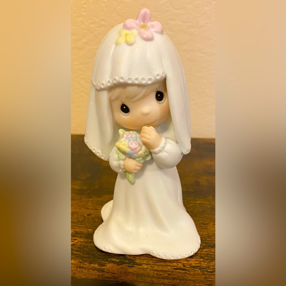 Artwork by the late Sam Butcher. Precious Moments Figurine.